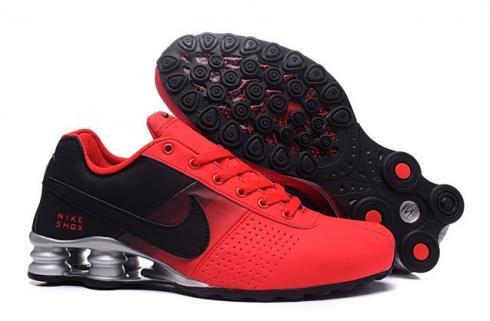 nike red black trainers
